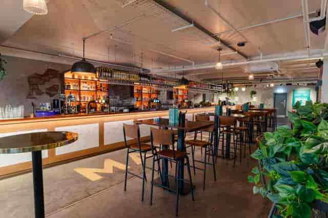 Stylish bar venue with modern furnishings for networking events in Market Halls Oxford Street.