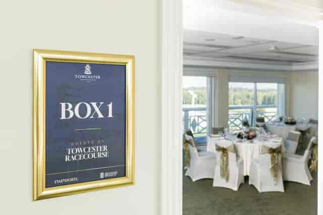 Premium VIP box with round tables at Towcester Racecourse for corporate events and hospitality.