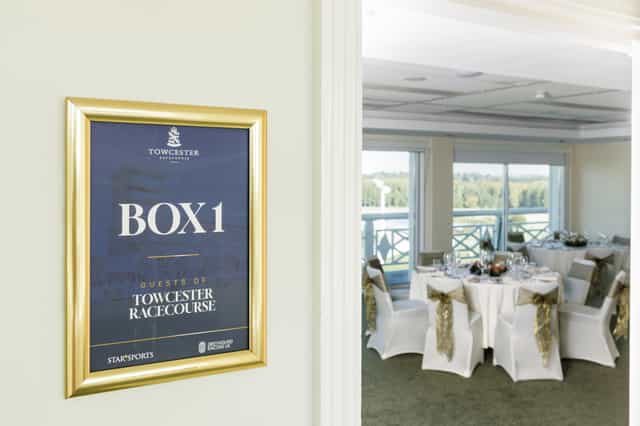 Premium VIP box with round tables at Towcester Racecourse for corporate events and hospitality.