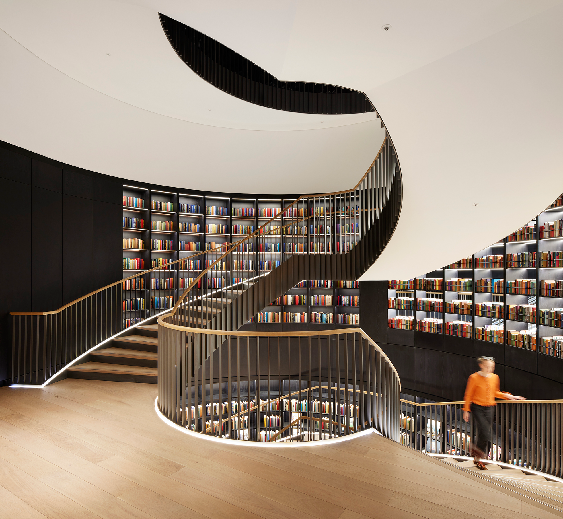 Spiral staircase in modern event suite, ideal for meetings and creative workshops. - Banner