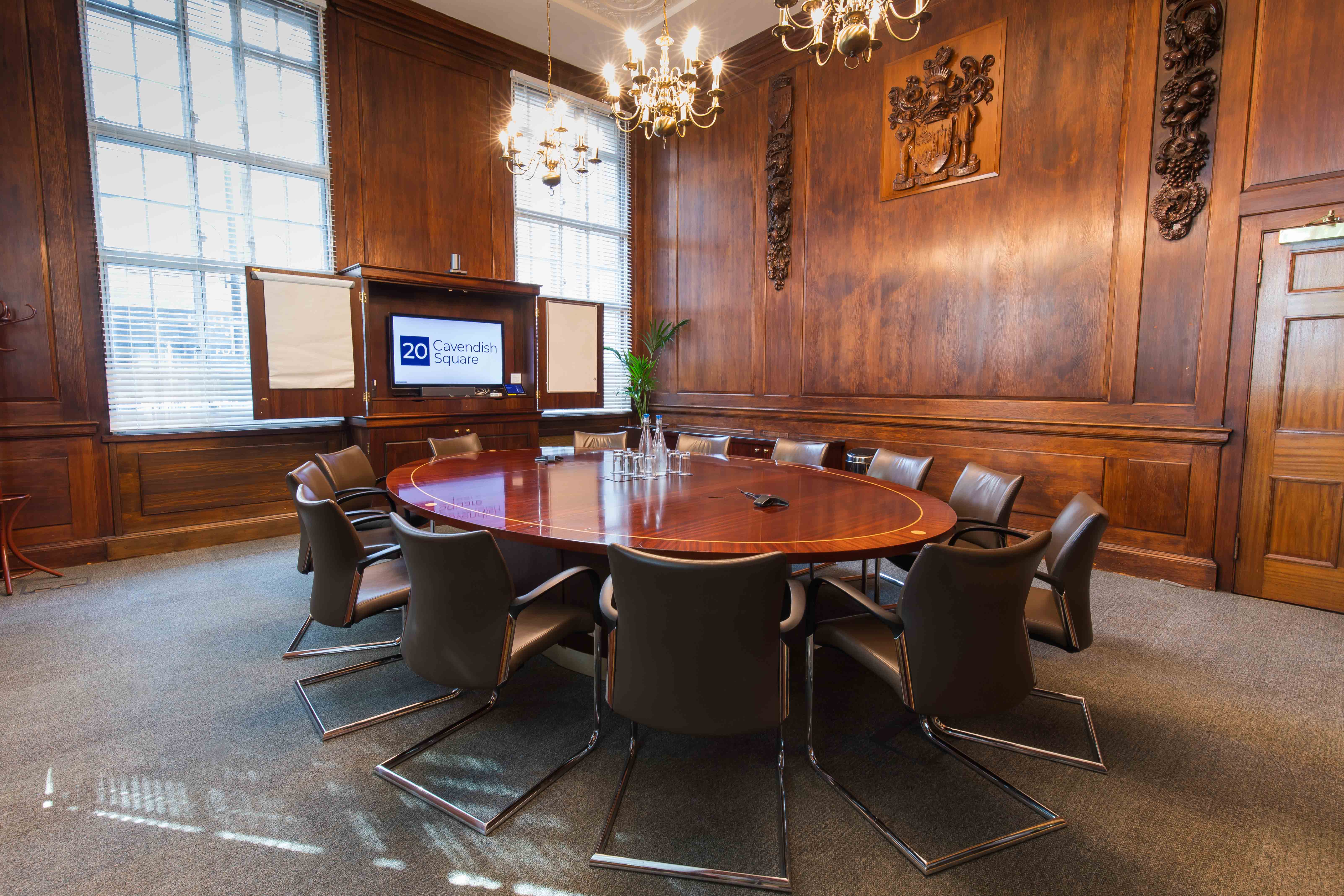 "Sarah Swift in a sophisticated conference room with warm wood paneling for executive meetings"