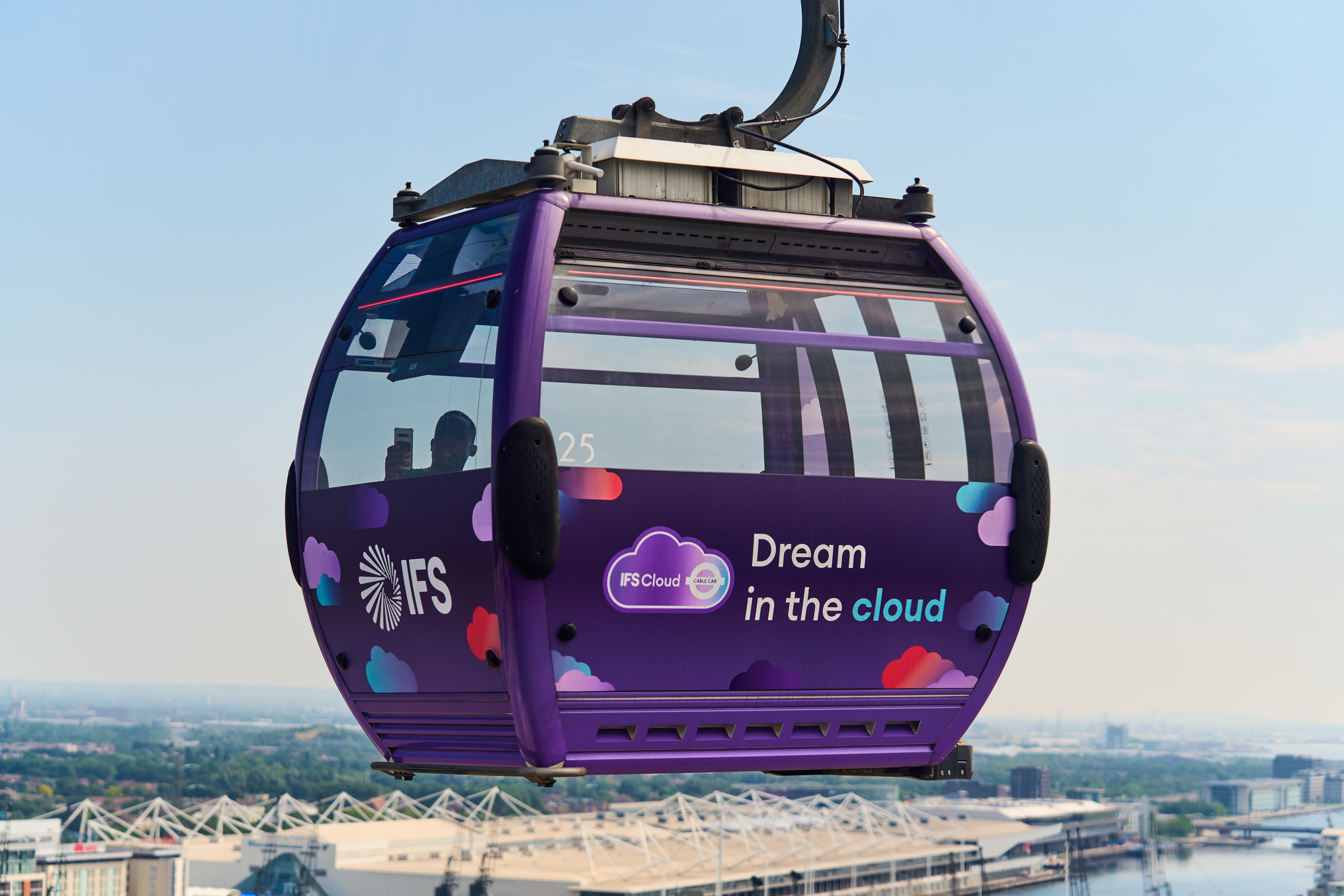 Vibrant cable car cabin in London, perfect for events and networking. - Banner