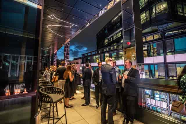 Sophisticated networking event at Nica's Bar, outdoor terrace in London's West End theatre.