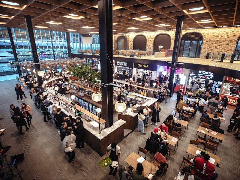 Vibrant Market Halls venue with natural light, ideal for events and networking.