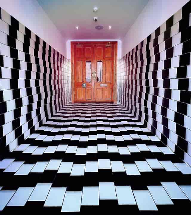 Disorienting patterned flooring in Quirky Quarter event space for venue rental or party planning.