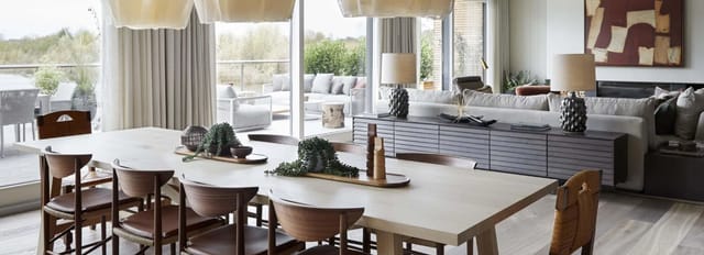 Modern meeting space at The Reserve, featuring a large wooden table in stylish design.