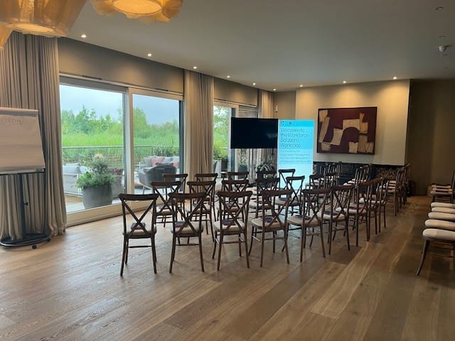 Meeting space at The Reserve in The Lakes with wooden chairs for corporate events.