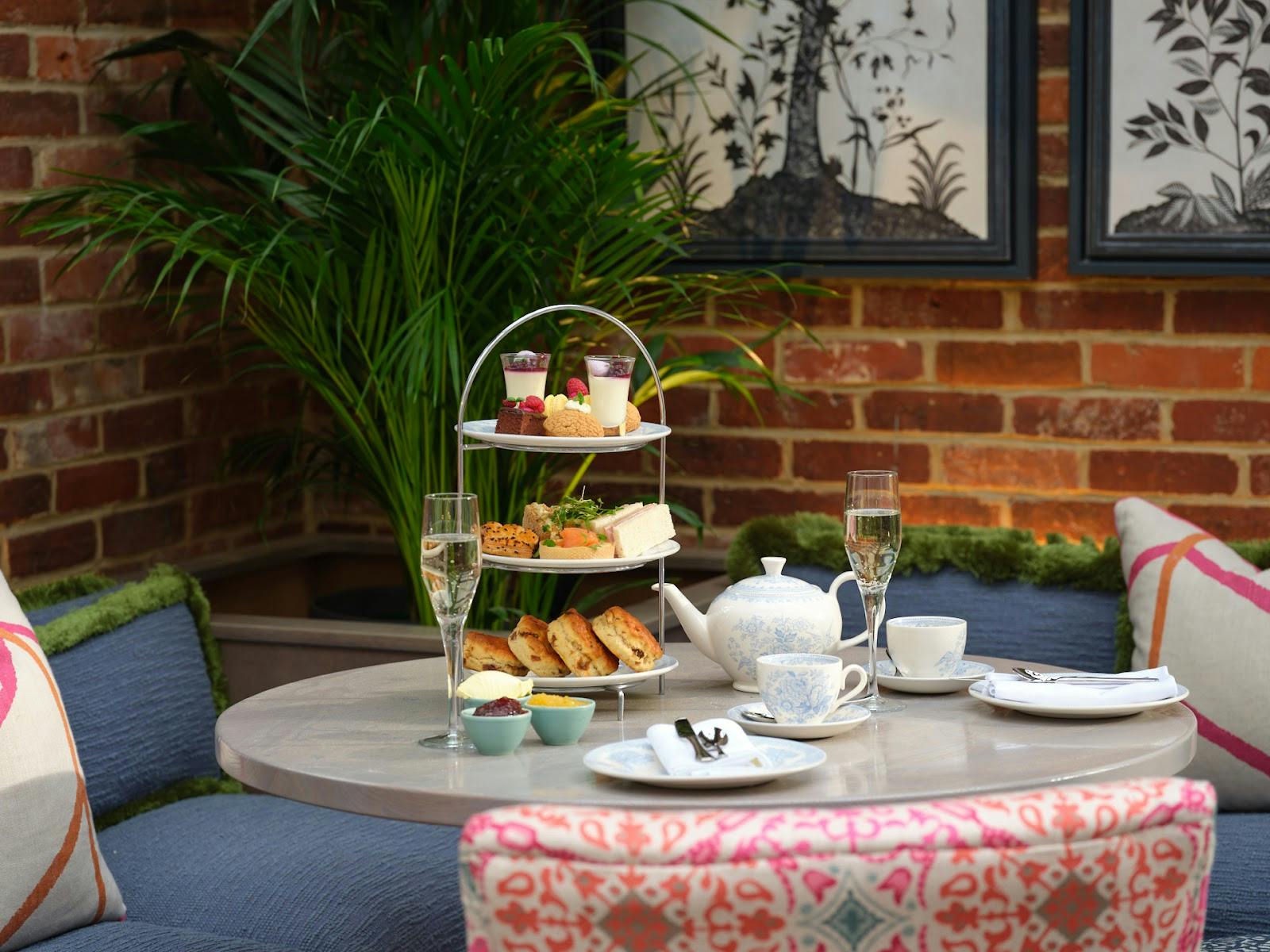 Elegant afternoon tea setup at The Orangery in Stanwell House for networking events.