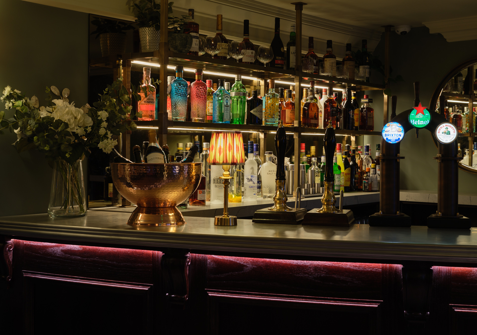 Salt Bar in Stanwell House with vibrant spirits, perfect for socializing events. - Banner