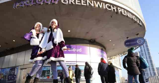 Festive performers at Christmas party entrance, IFS Cloud Cable Car, London.