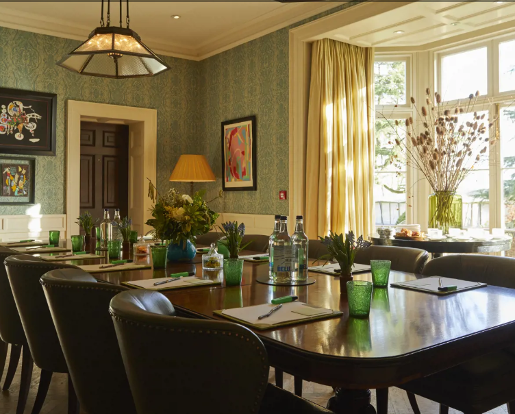 The Scullery meeting room at Lime Wood, featuring elegant decor and natural light. - Banner