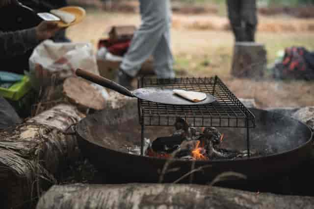 Fireside catering at Birmingham Nature Zone: immersive outdoor event venue for attendee engagement.