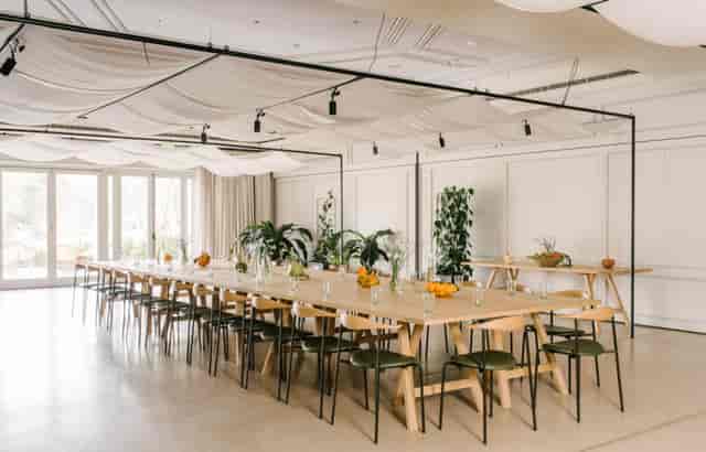 Heckfield Place Assembly Room with elegant table for meetings and brainstorming events.