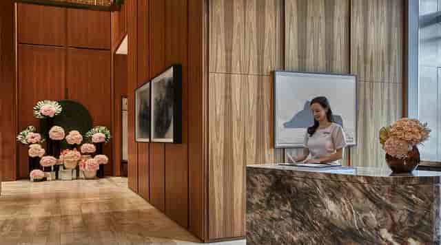 Luxury hotel meeting room with wood paneling for executive corporate events.