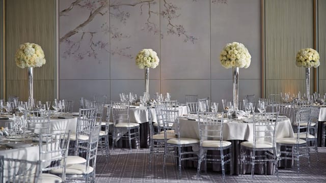 Elegant Four Seasons Toronto banquet hall with floral centerpieces for luxury weddings and galas.