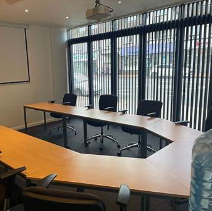 Modern conference room in The Vault Morden with ergonomic chairs for meetings. - Banner