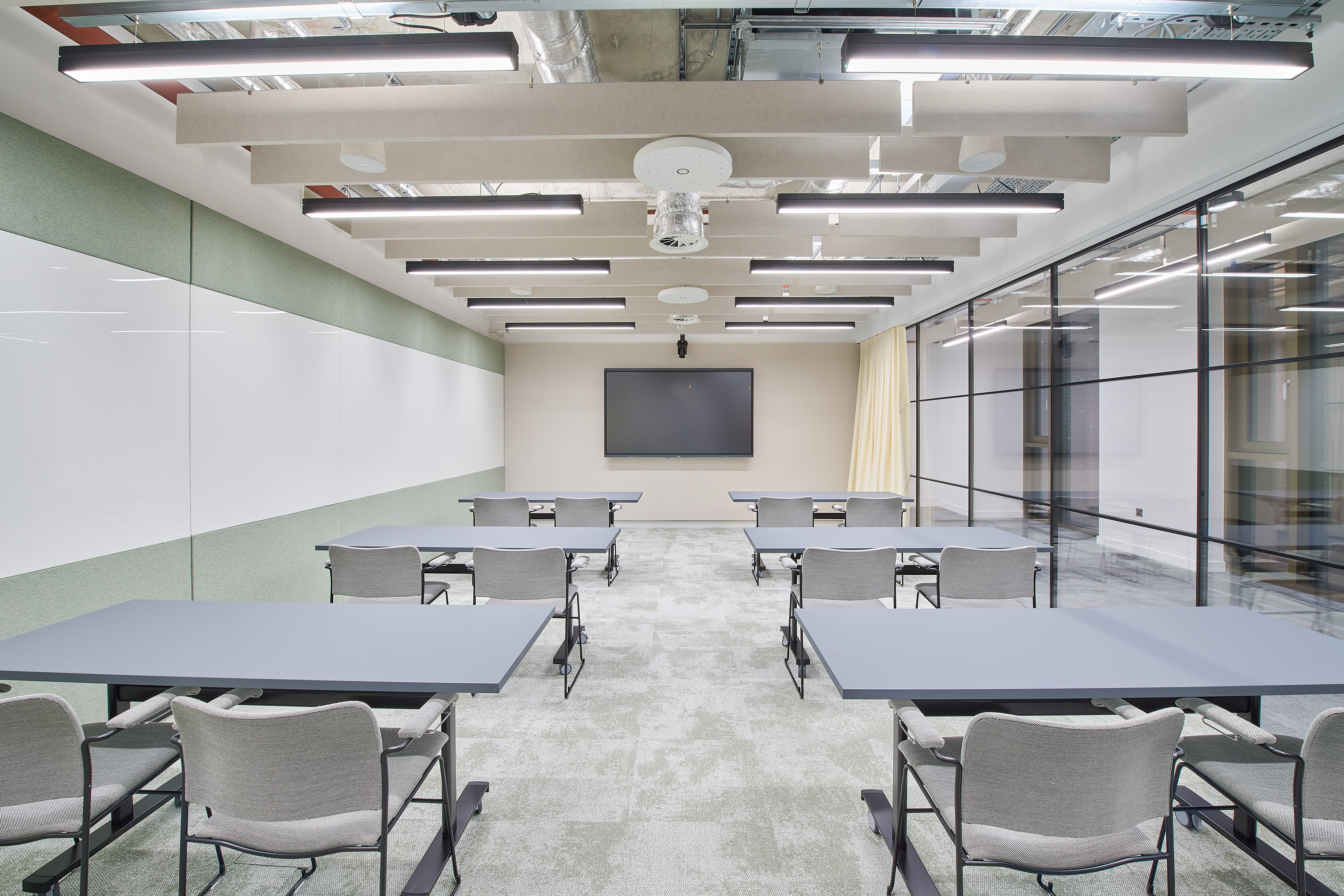 Modern boardroom set for classroom training in EdCity, ideal for corporate seminars and workshops. - Banner