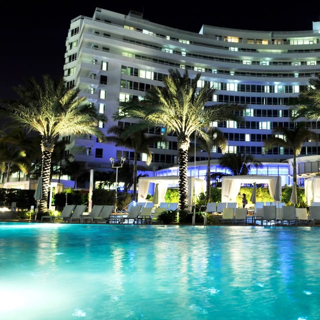 Luxurious hotel pool at night, perfect for elegant events and networking in Miami Beach.