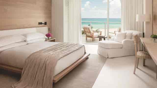 Luxury guest room at The Miami Beach EDITION with ocean view for executive retreats and VIP events.