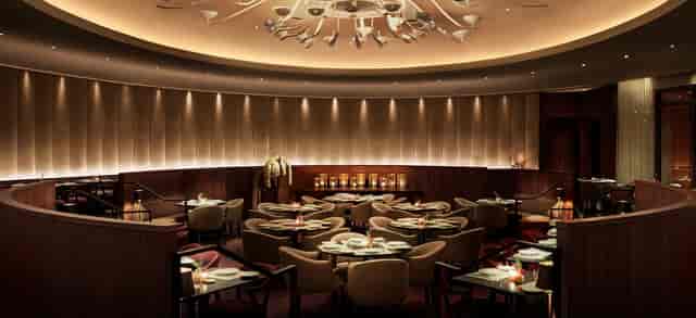 Executive dinner venue at The Miami Beach EDITION with circular lighting for VIP receptions.
