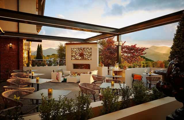 The Garden Room outdoor venue with fireplace for corporate networking and evening reception events.