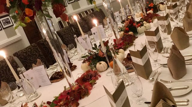 Autumnal banquet setup with glass centerpieces at Aghadoe Heights Hotel, luxury event venue.