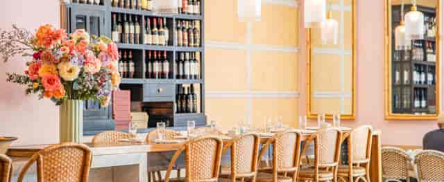 Elegant dining space with wooden table, perfect for business lunches and intimate events.