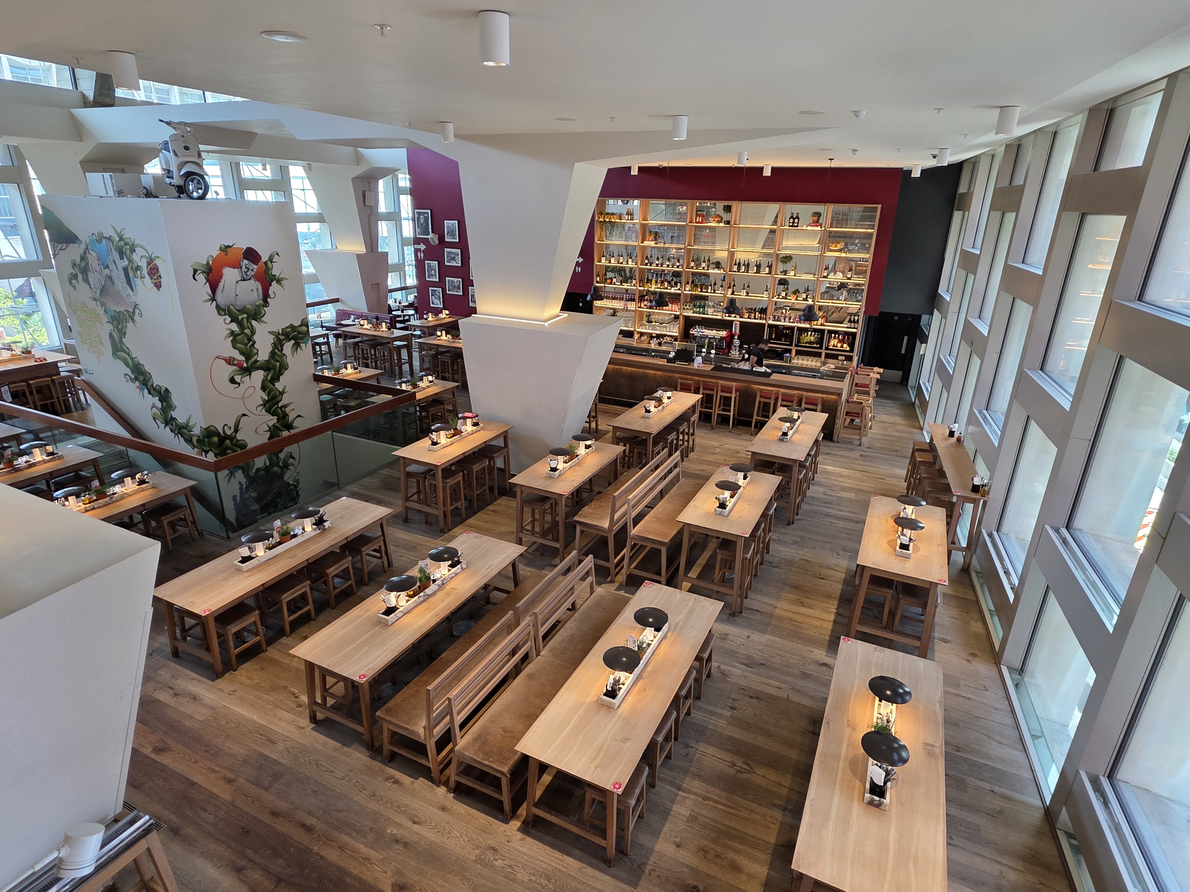 Exclusive hire venue with long wooden tables, ideal for meetings and events in London.