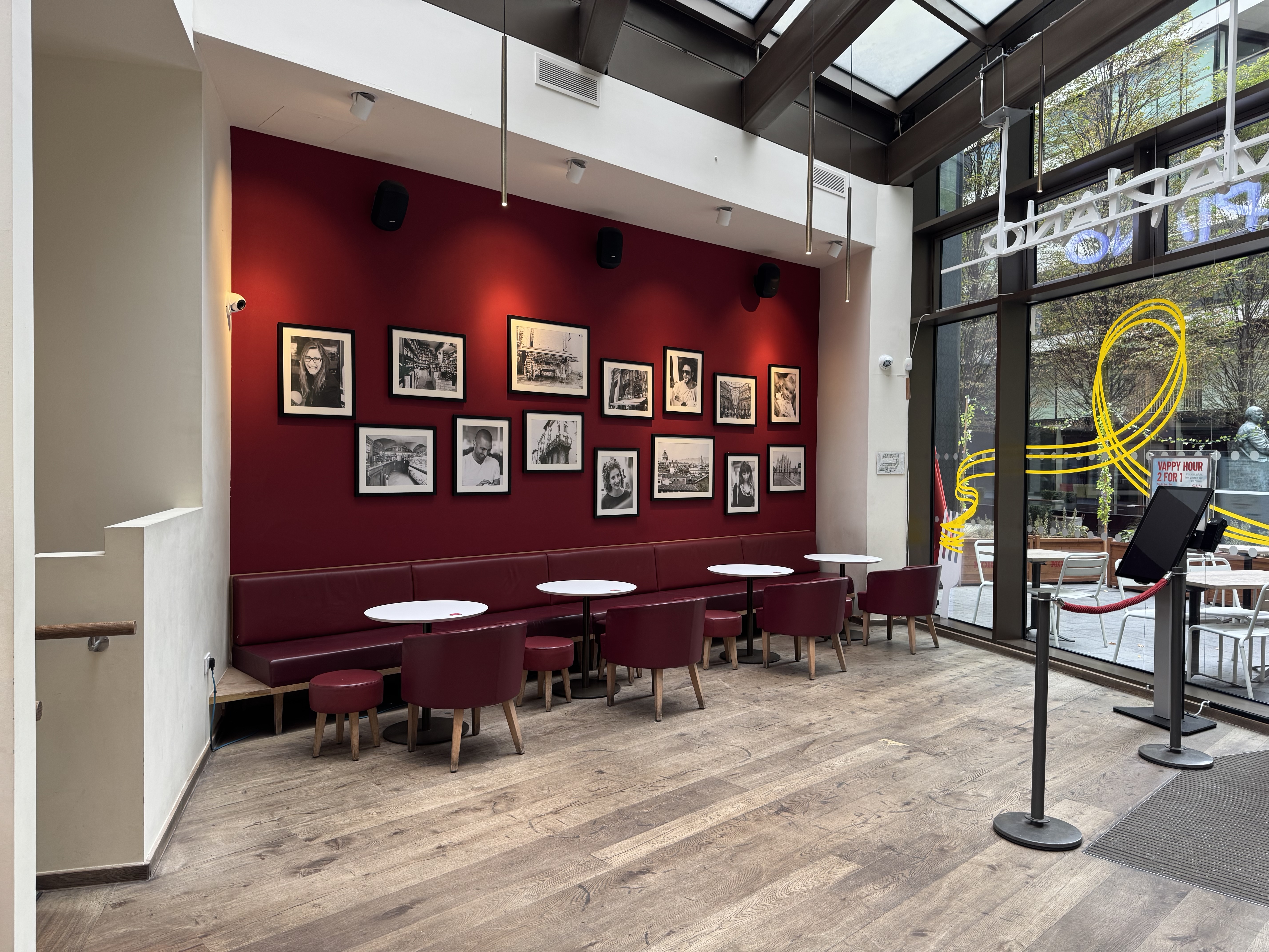 Stylish Vapiano Tower Bridge bar with warm red walls, perfect for events and networking.