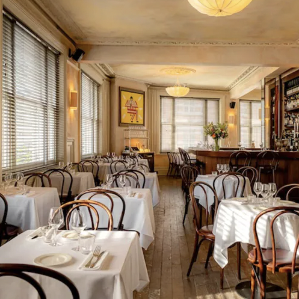 Elegant restaurant venue for intimate meetings and events with warm lighting and cozy decor.