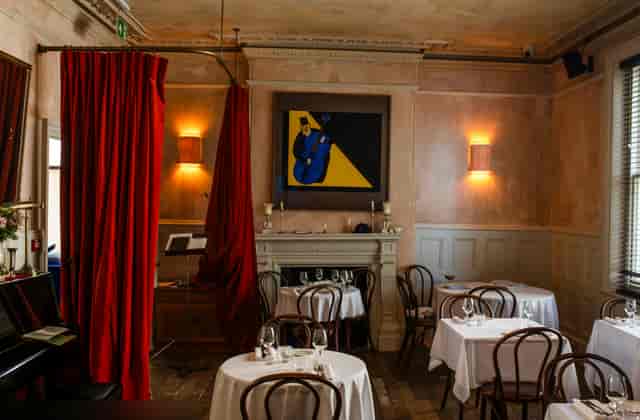 Sophisticated dining space in The Apartment, ideal for intimate meetings and upscale events.