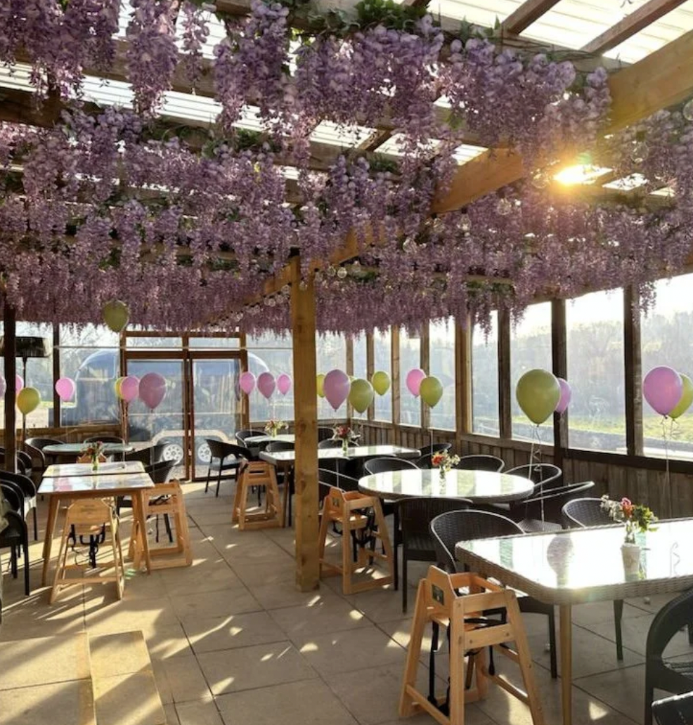Charming floral canopy in Walled Garden West Wycombe, perfect for weddings and events. - Banner