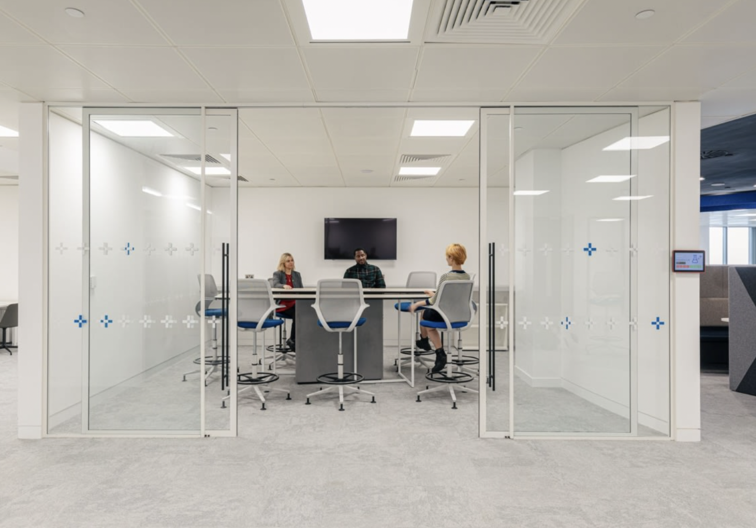 Modern glass meeting room at Datatonic, perfect for collaboration and presentations. - Banner