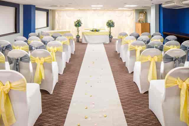 Summit Suite wedding ceremony at Mercure Swansea Hotel with classic aisle decor.