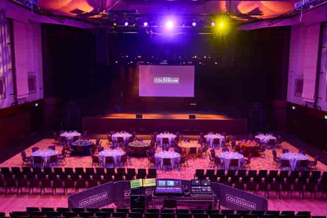 Watford Colosseum auditorium, banquet-style plenary setup for corporate events and gala dinners.