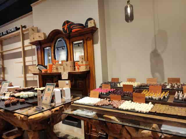 Chocolate cafe dessert station with slate platters for corporate catering and event displays.