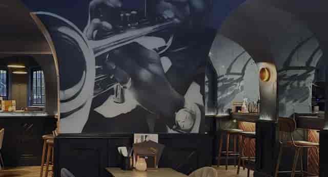 The Gear Room at The Manor of Hurst: Moody VIP reception venue with bold art for themed events.