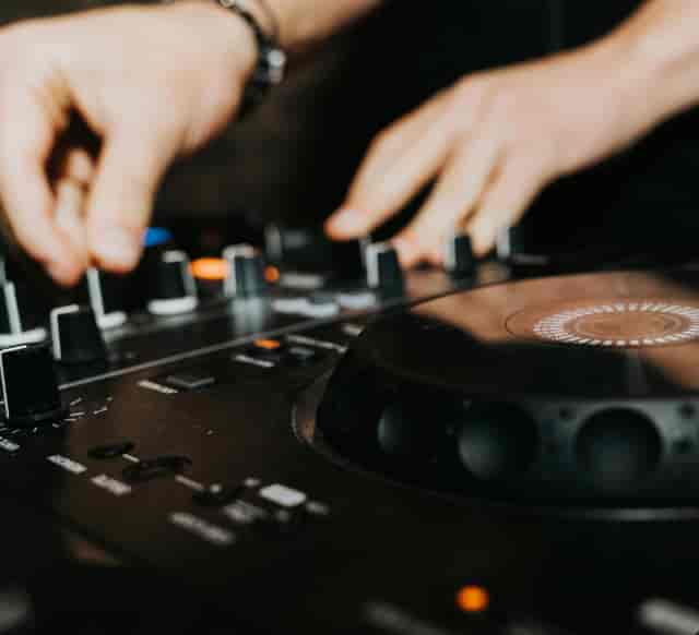 Professional DJ at Bootlegger Bars Bath, gala event audio setup for networking mixer.