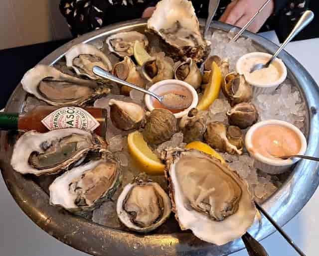 Seafood raw bar display with ice presentation for upscale event or VIP reception.