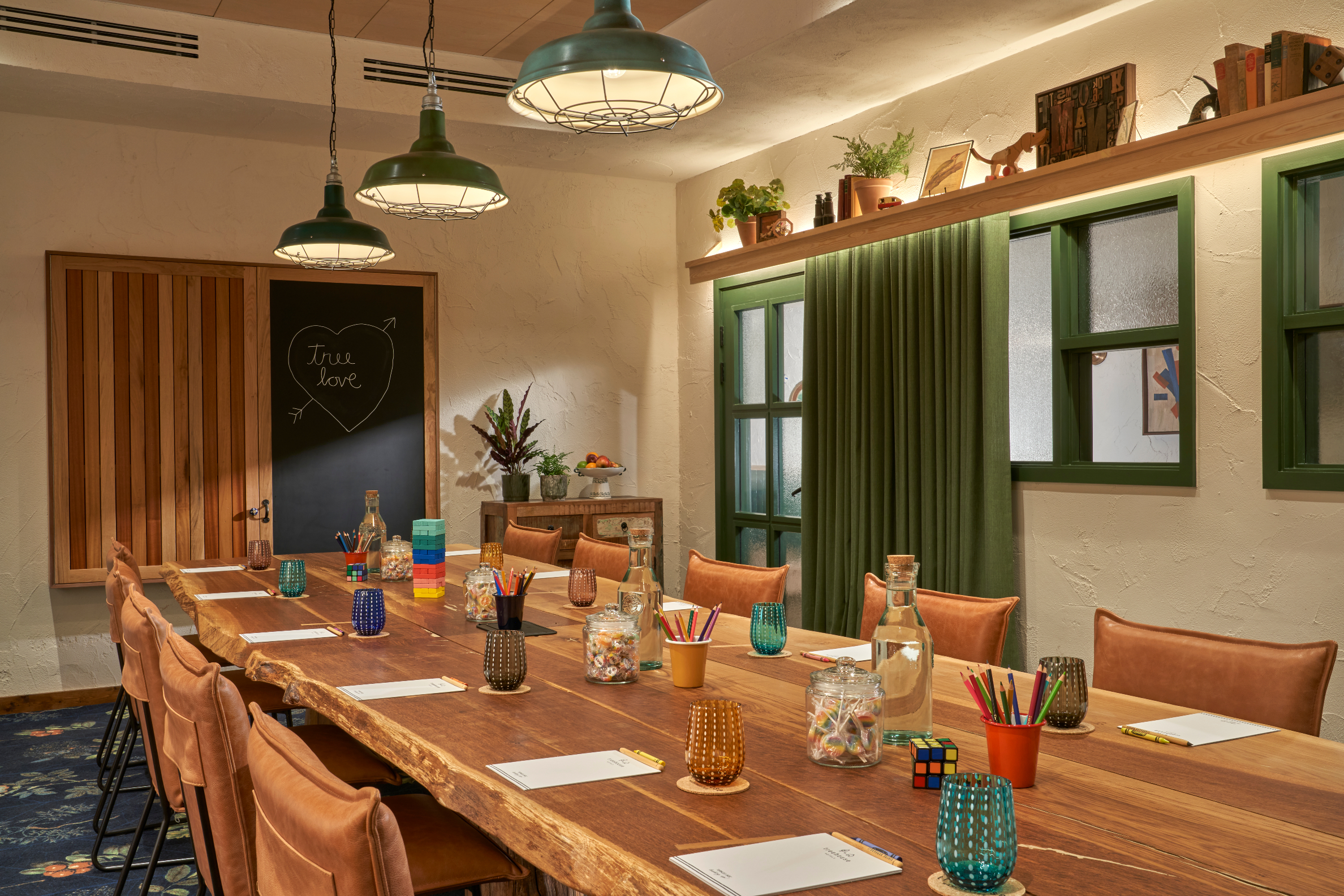Walnut meeting room at Treehouse Hotel Manchester with wooden table, ideal for workshops.