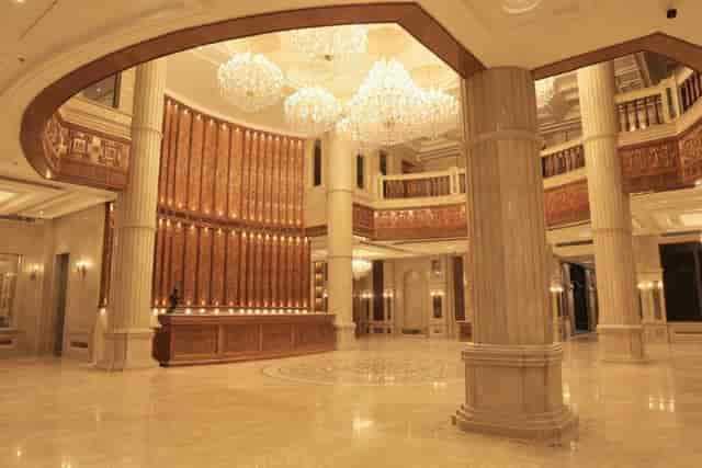 Grand Mandap lobby with ornate chandeliers for luxury gala and corporate event check-in.