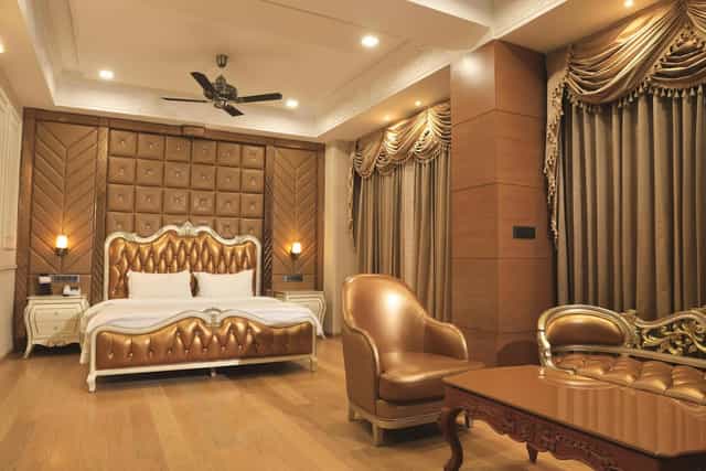 Grand Mandap luxury guest suite with ornate furnishings for VIP events and executive travel.