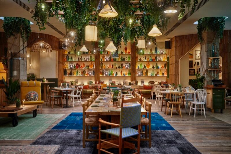 Pip in Treehouse Hotel Manchester dining space with wooden decor, ideal for events and meetings.