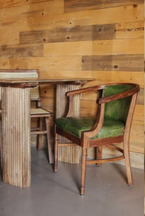Boutique wood breakout lounge with vintage seating for intimate networking events.