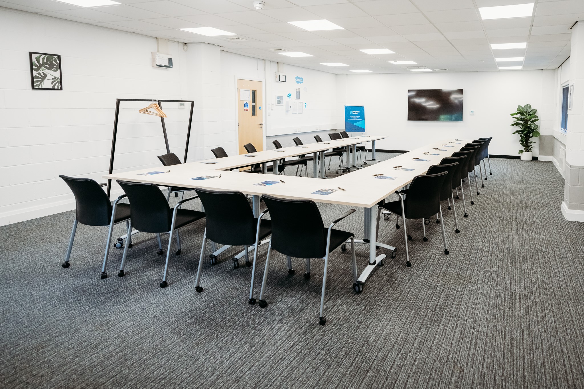 Europa House Conference Room: modern meeting space with digital screens for workshops.