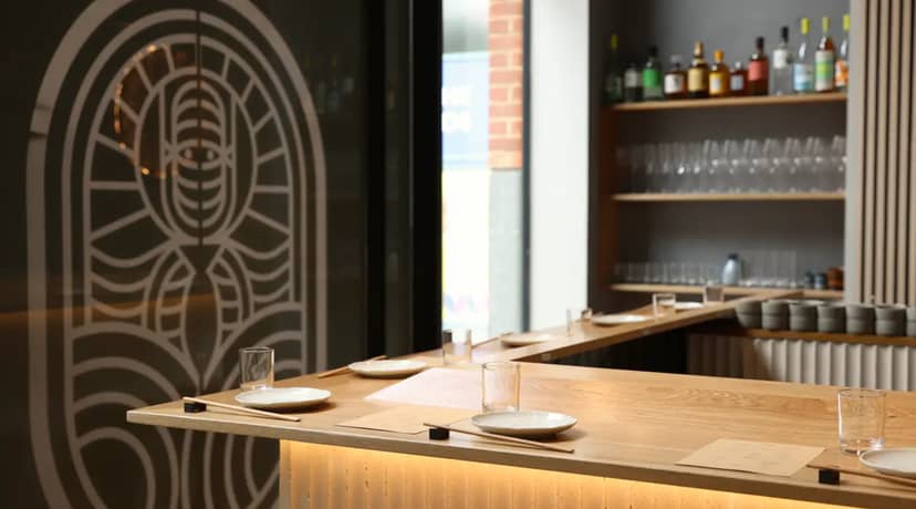 "Modern event space at Ukiyo Hand Roll Bar with sleek bar and minimalist decor."
