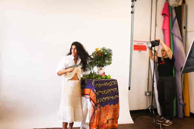 Model posing in vibrant photography studio at Rosetta Arts Centre for themed events.