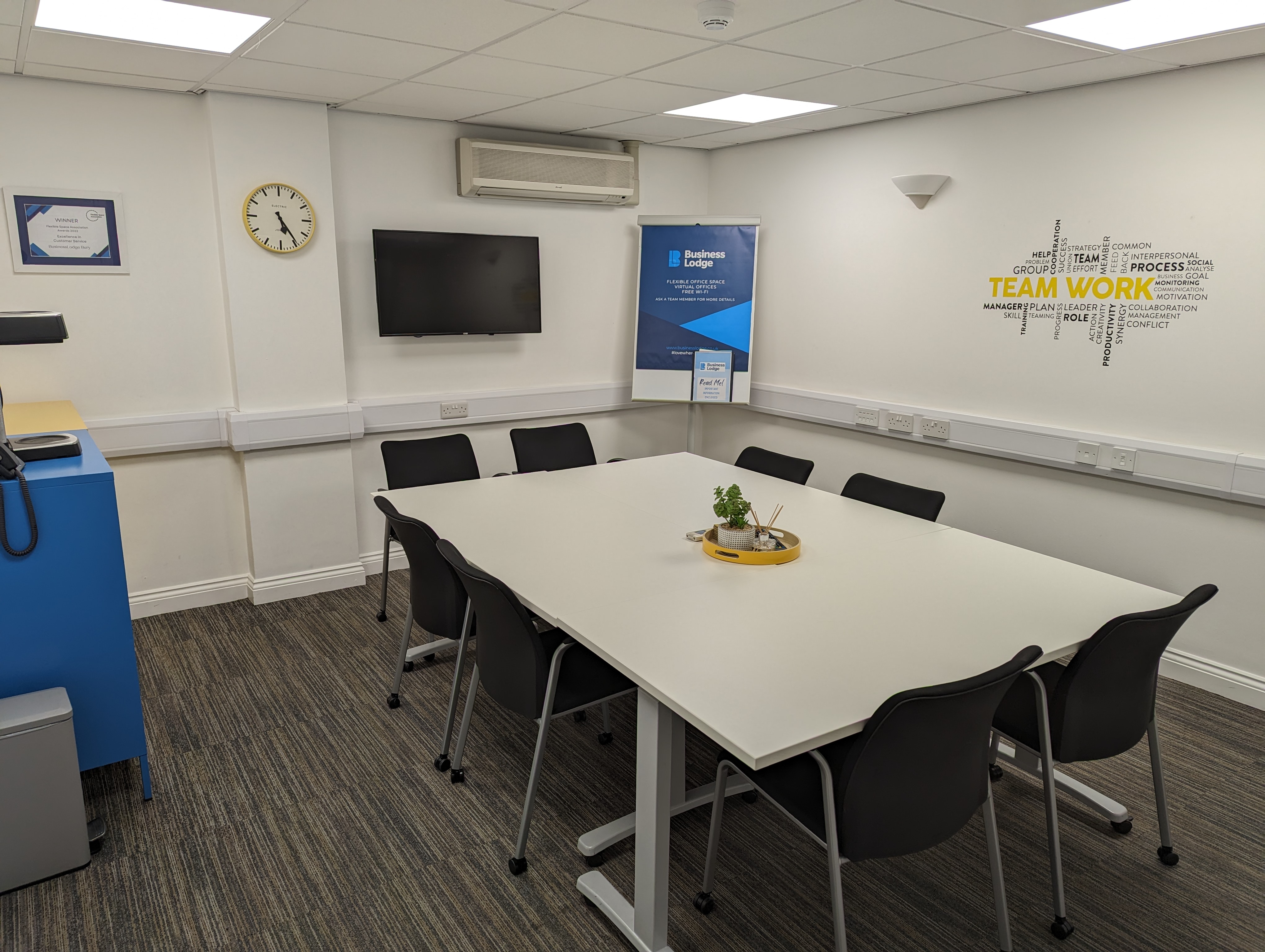 Meeting room 36 in Bury Businesslodge with central table, ideal for workshops and meetings.