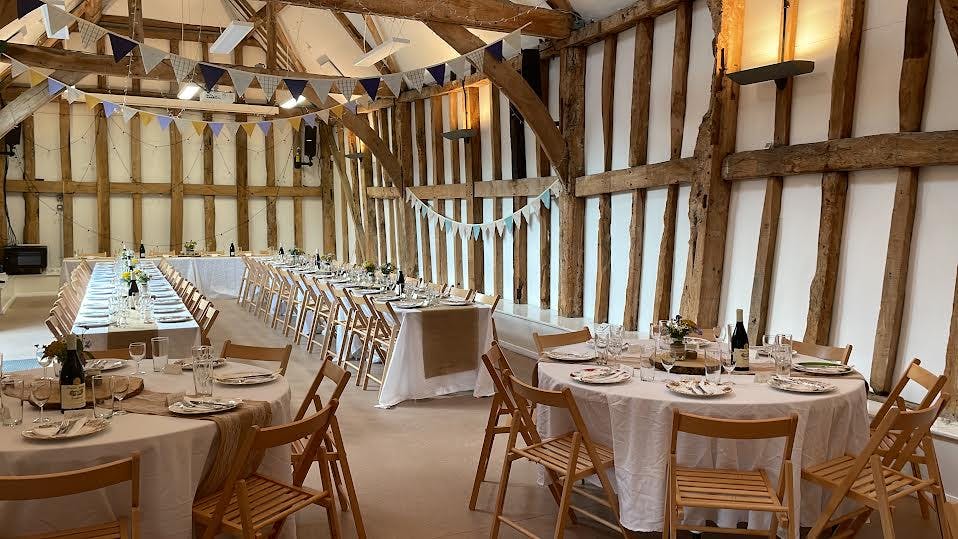 Charming Earth Trust courtyard with rustic beams for elegant weddings and corporate events.