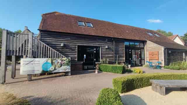 Rustic event venue Courtyard at Earth Trust with wooden architecture for corporate retreats.